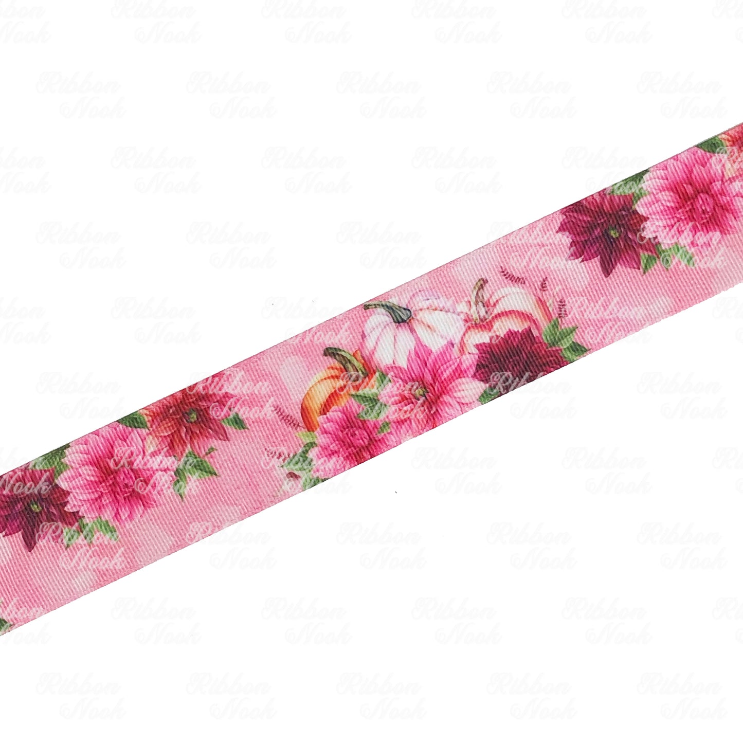 pumpkins behind a cluster of pink and burgundy dahlia flowers grosgrain ribbon