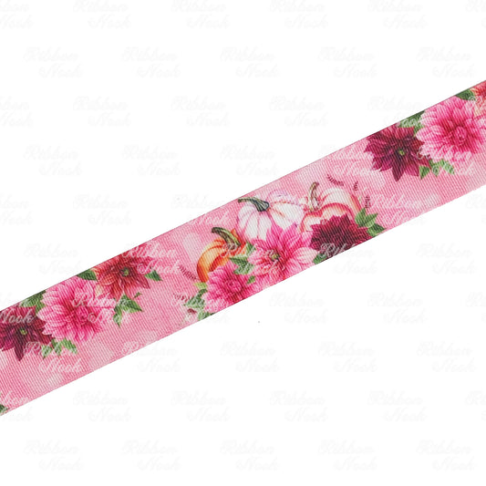 pumpkins behind a cluster of pink and burgundy dahlia flowers grosgrain ribbon